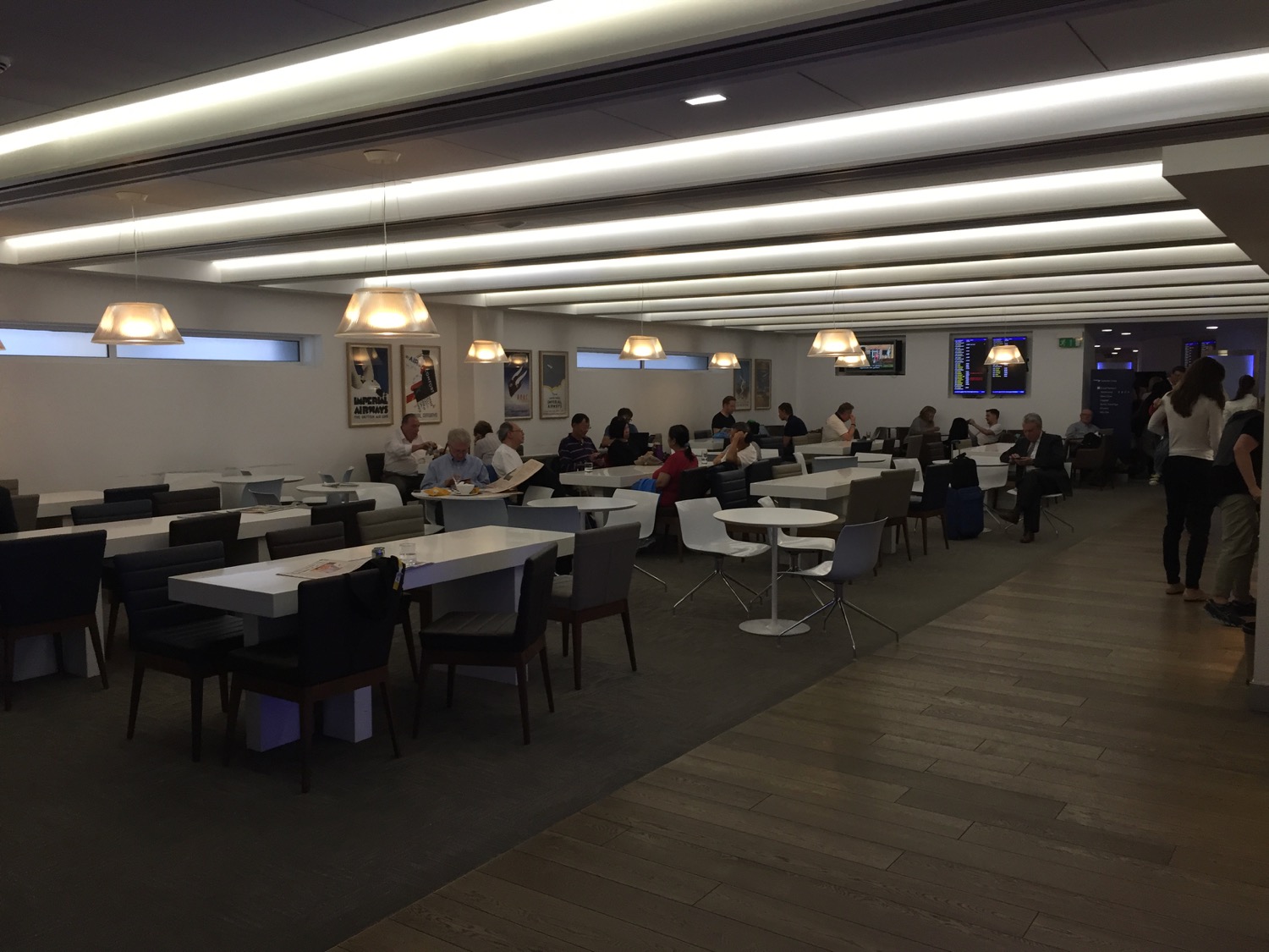 a group of people sitting at tables in a room