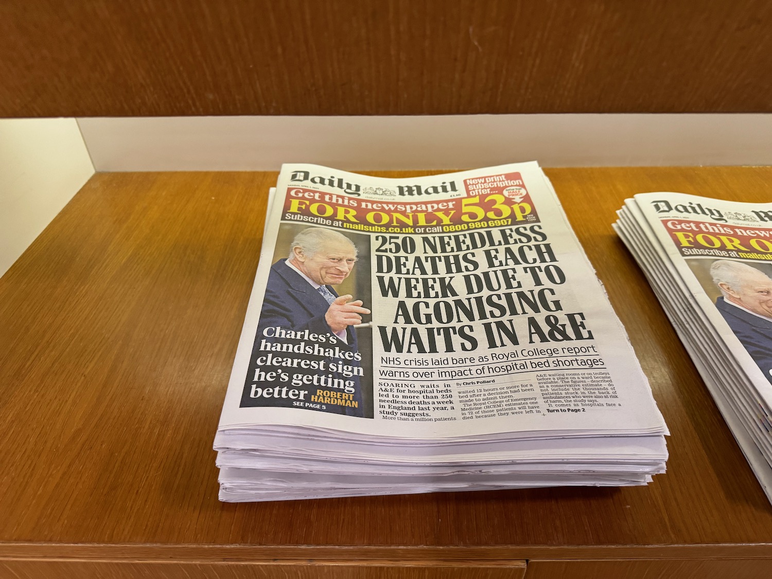 a stack of newspapers on a table