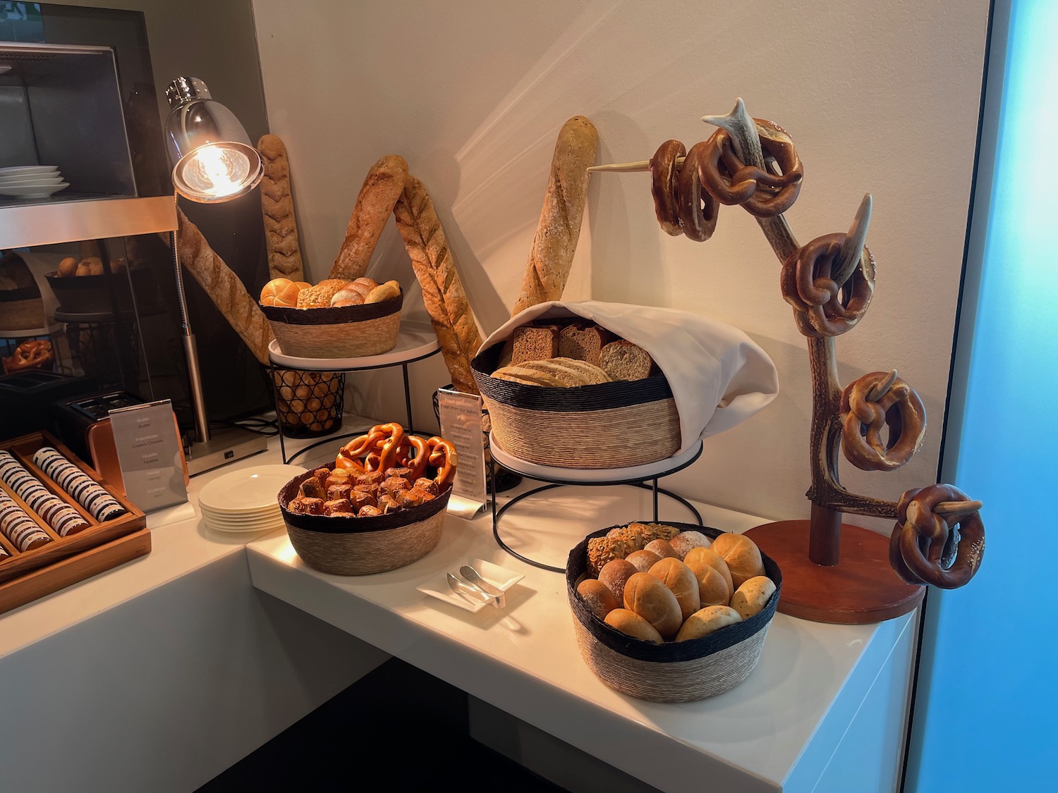 a table with bread and pretzels