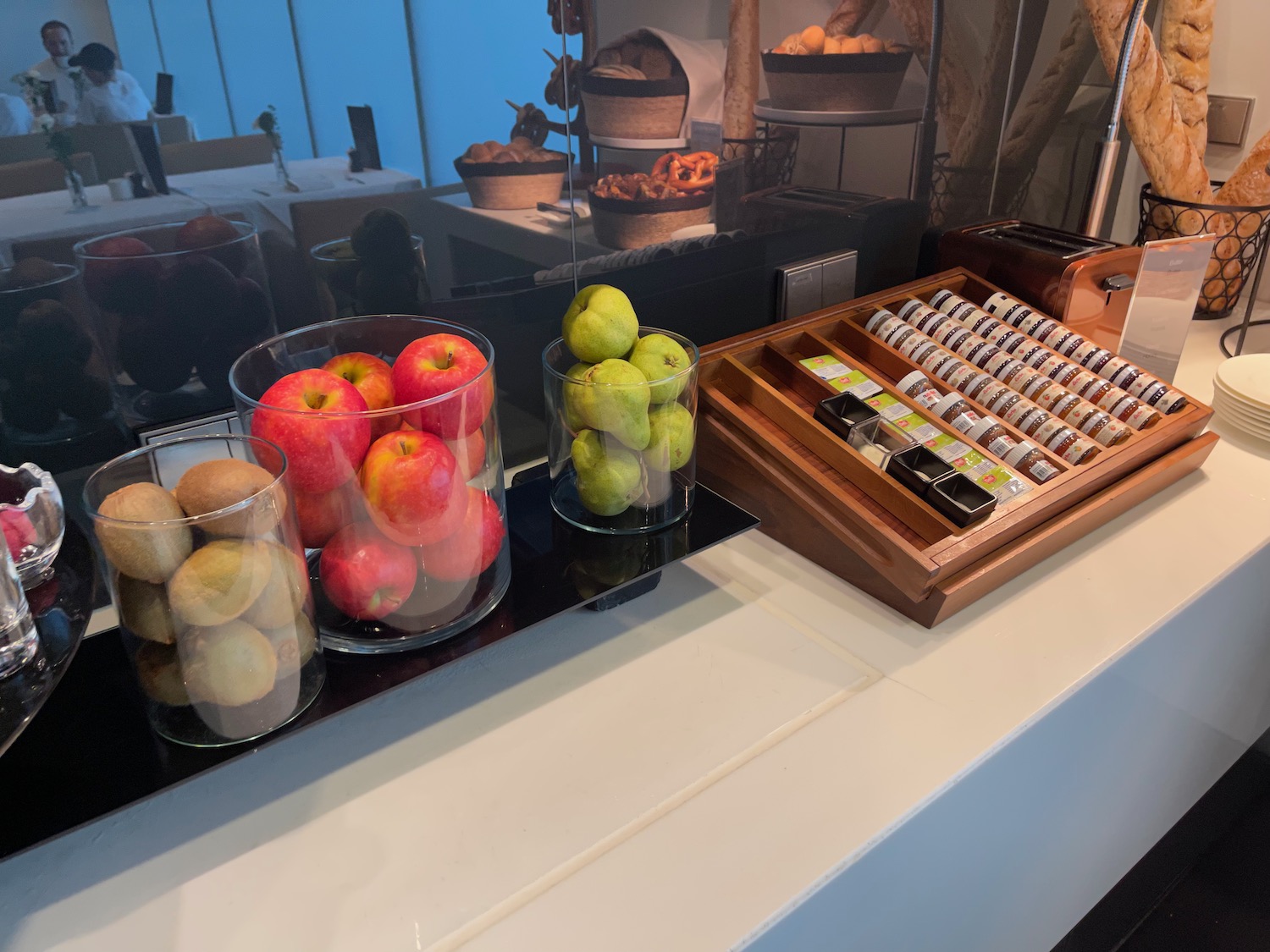a counter with fruits and a cash register