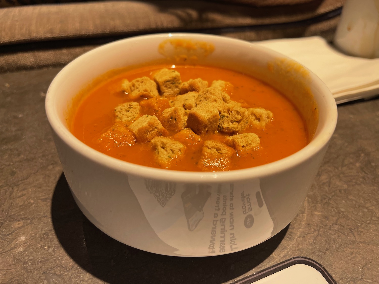 a bowl of soup with croutons