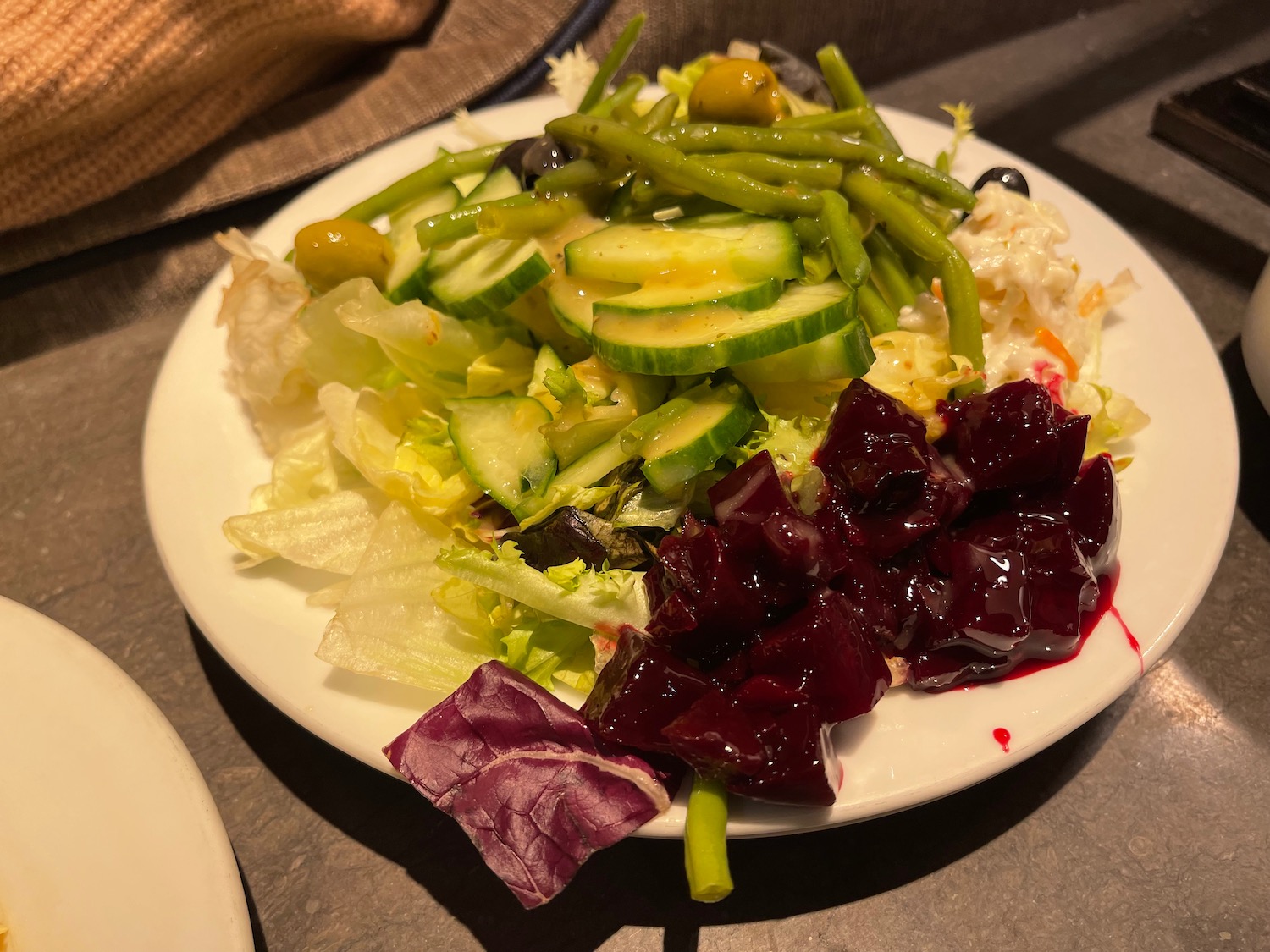 a plate of salad on a table