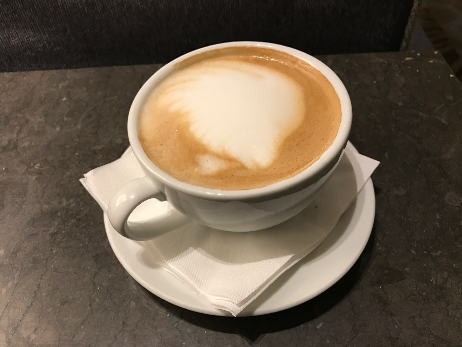 a cup of coffee on a saucer