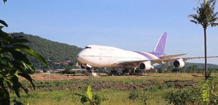 a large white airplane on a runway