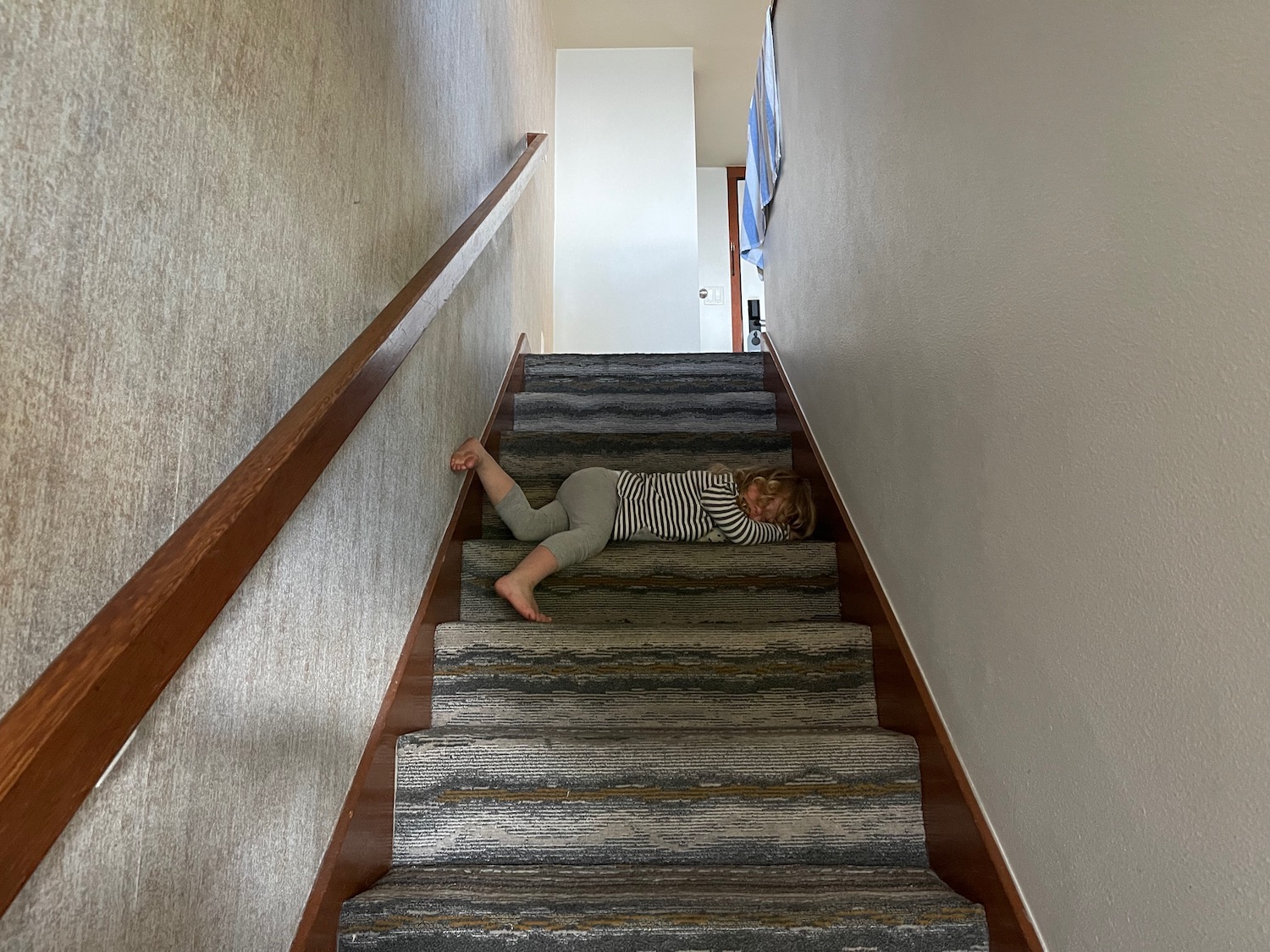 a child lying on stairs