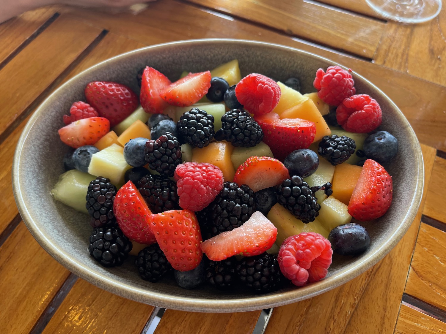 a bowl of fruit on a table