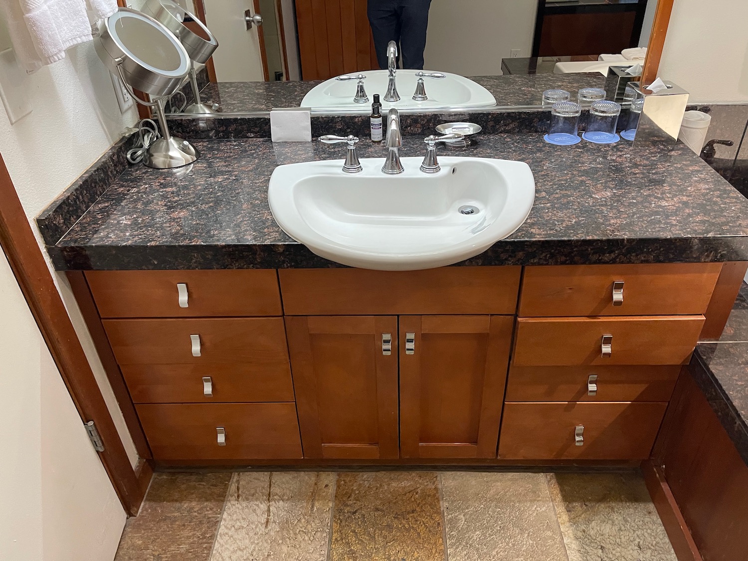 a bathroom sink with a mirror and a mirror