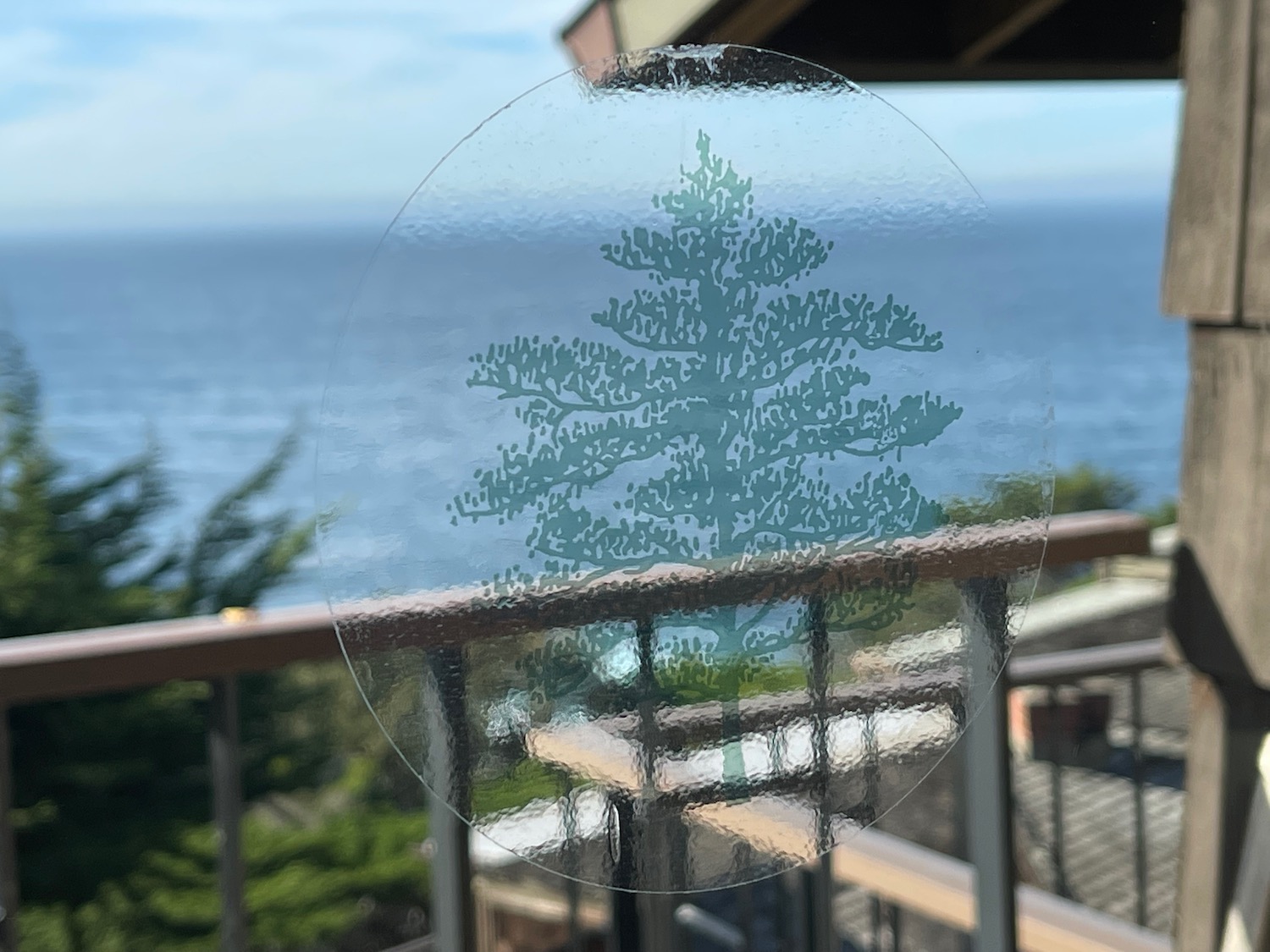 a glass with a tree on it