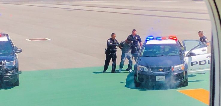 a police officers being arrested by a car