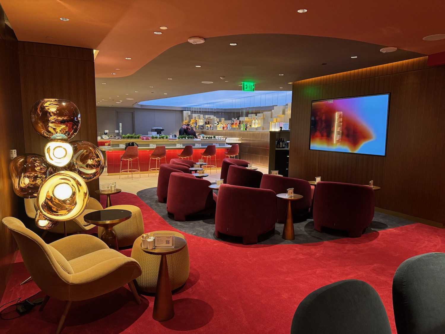 a room with red carpet and chairs