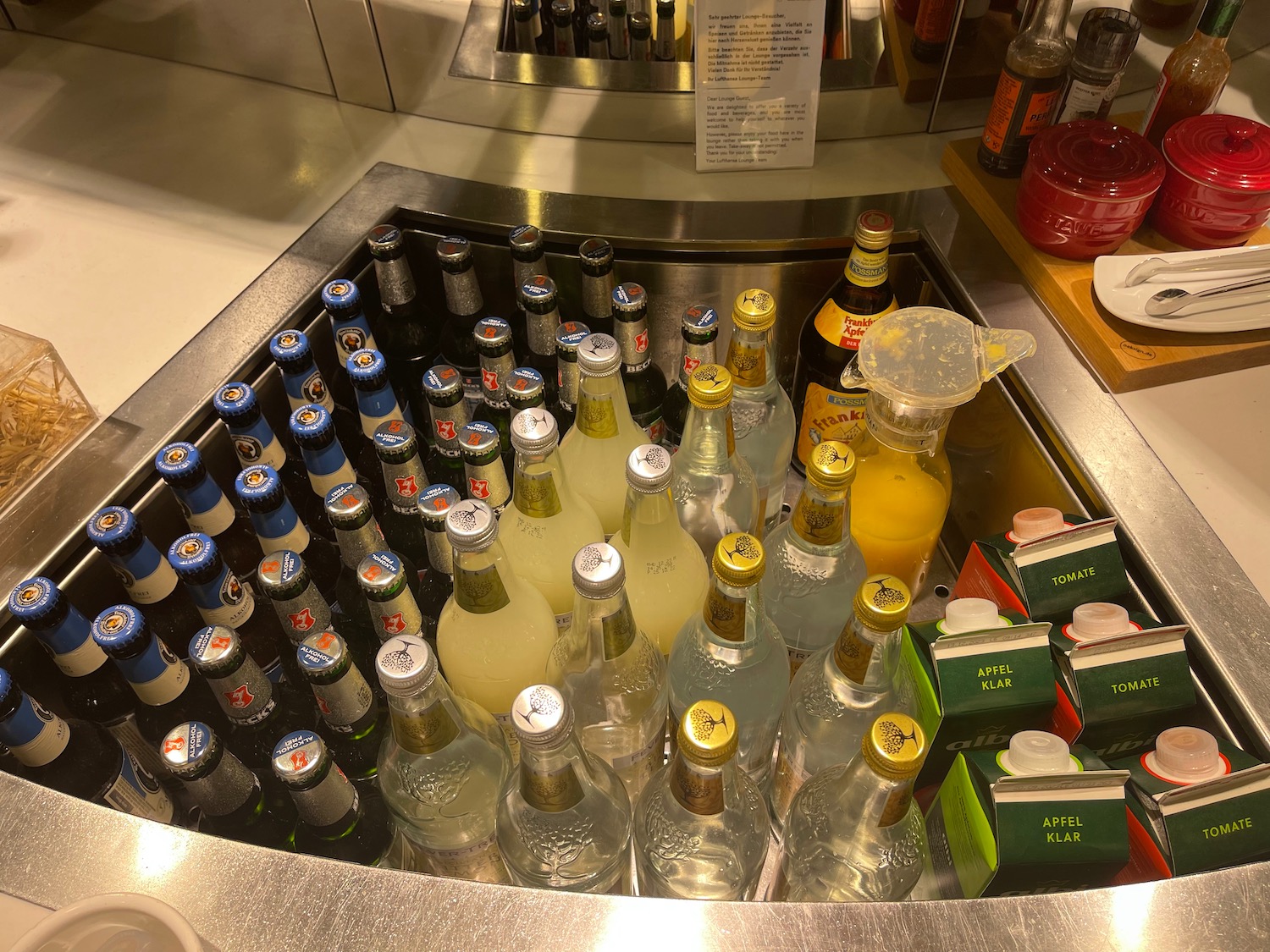 a group of bottles of liquid in a metal bar