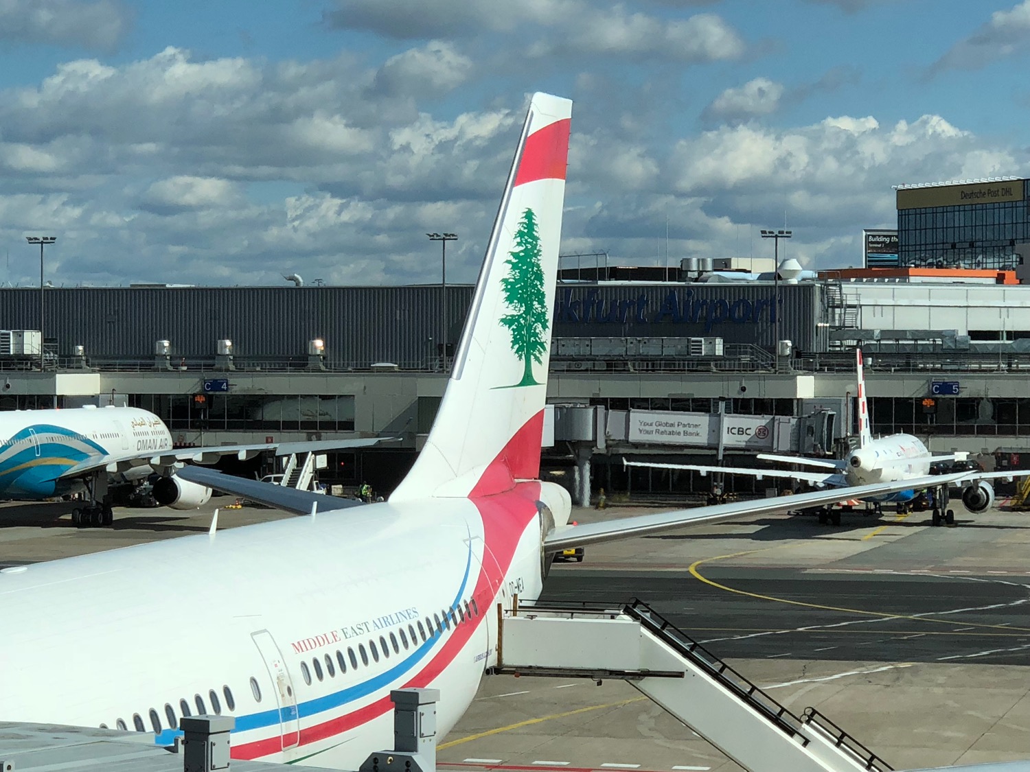 a group of airplanes at an airport