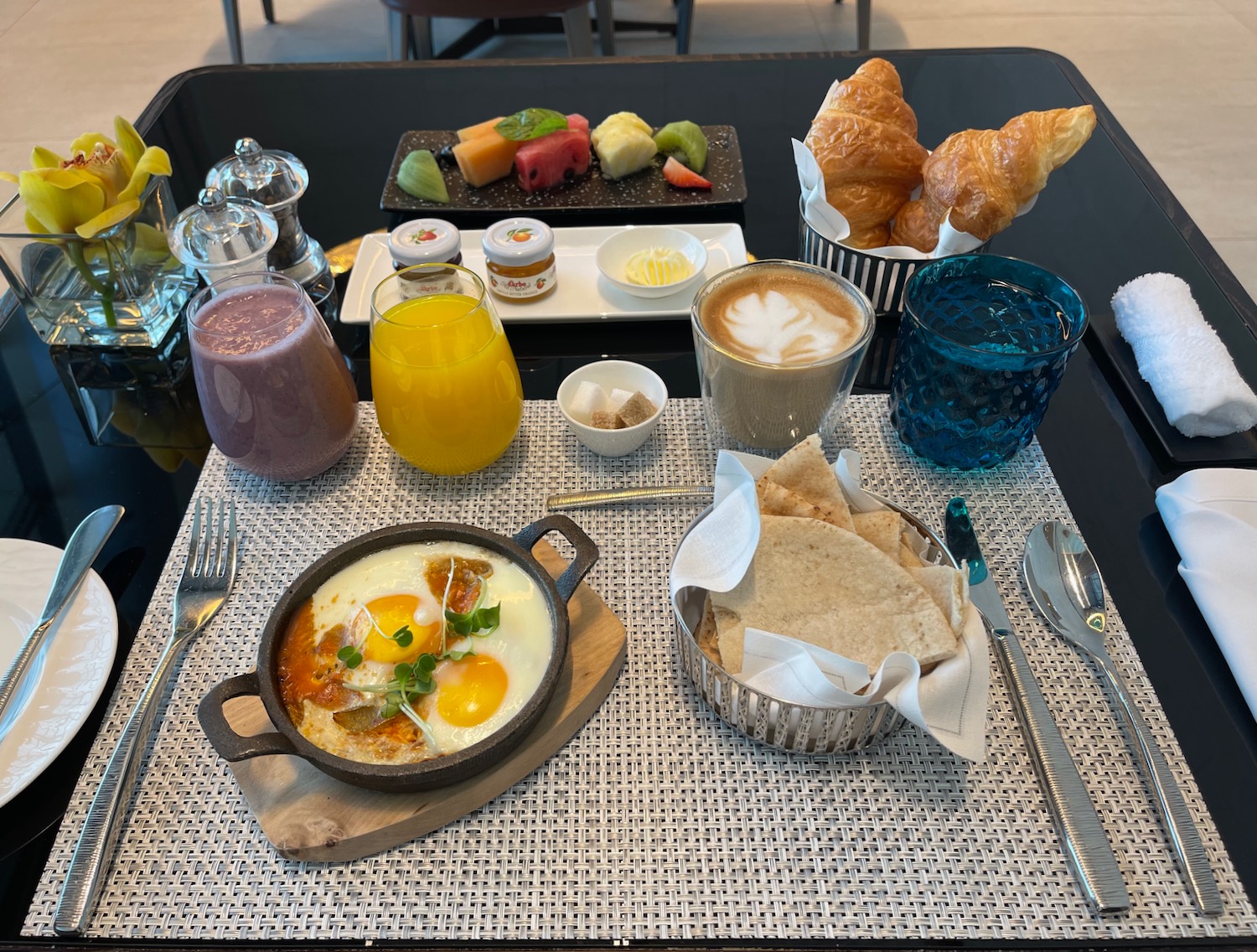 a breakfast table with food on it