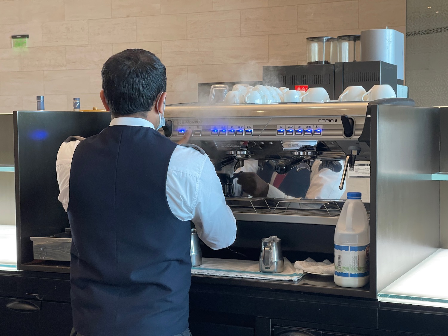 a man standing behind a machine