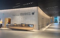 a lobby of a building with a reception desk