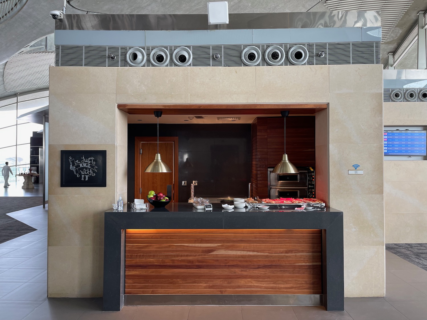 a counter with a wood and metal frame