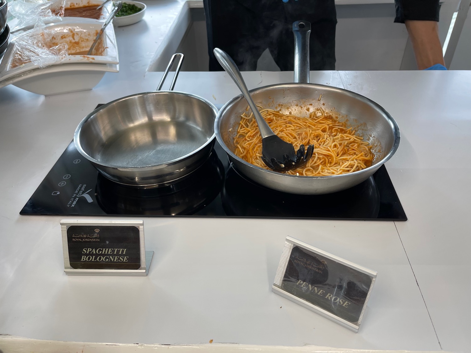 a pan with spaghetti in it on a stove