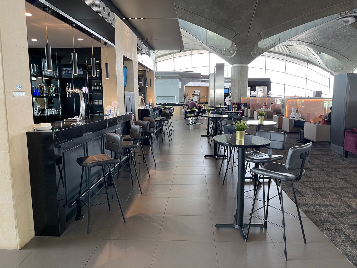 a bar with tables and chairs