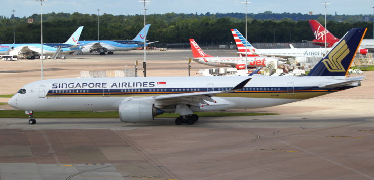 a group of airplanes on a runway