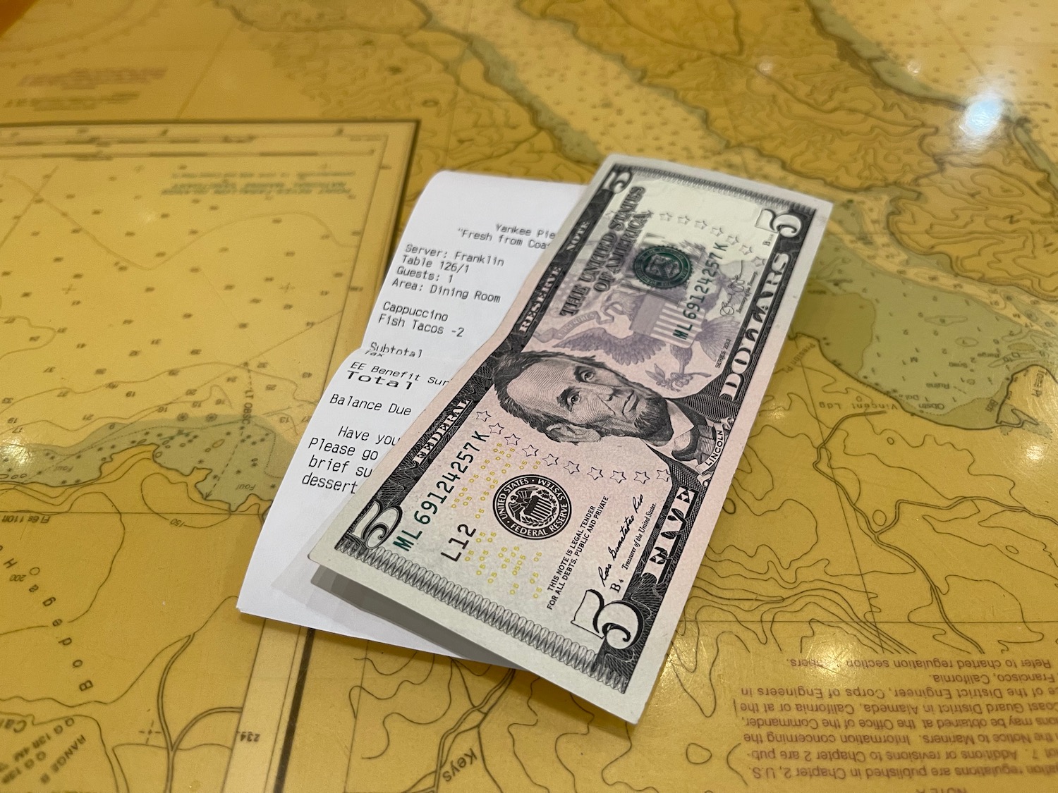 a paper money on a map