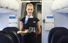 a woman holding a tray of food