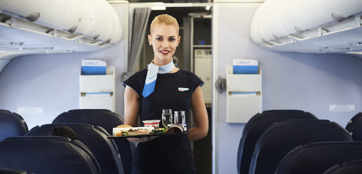 a woman holding a tray of food