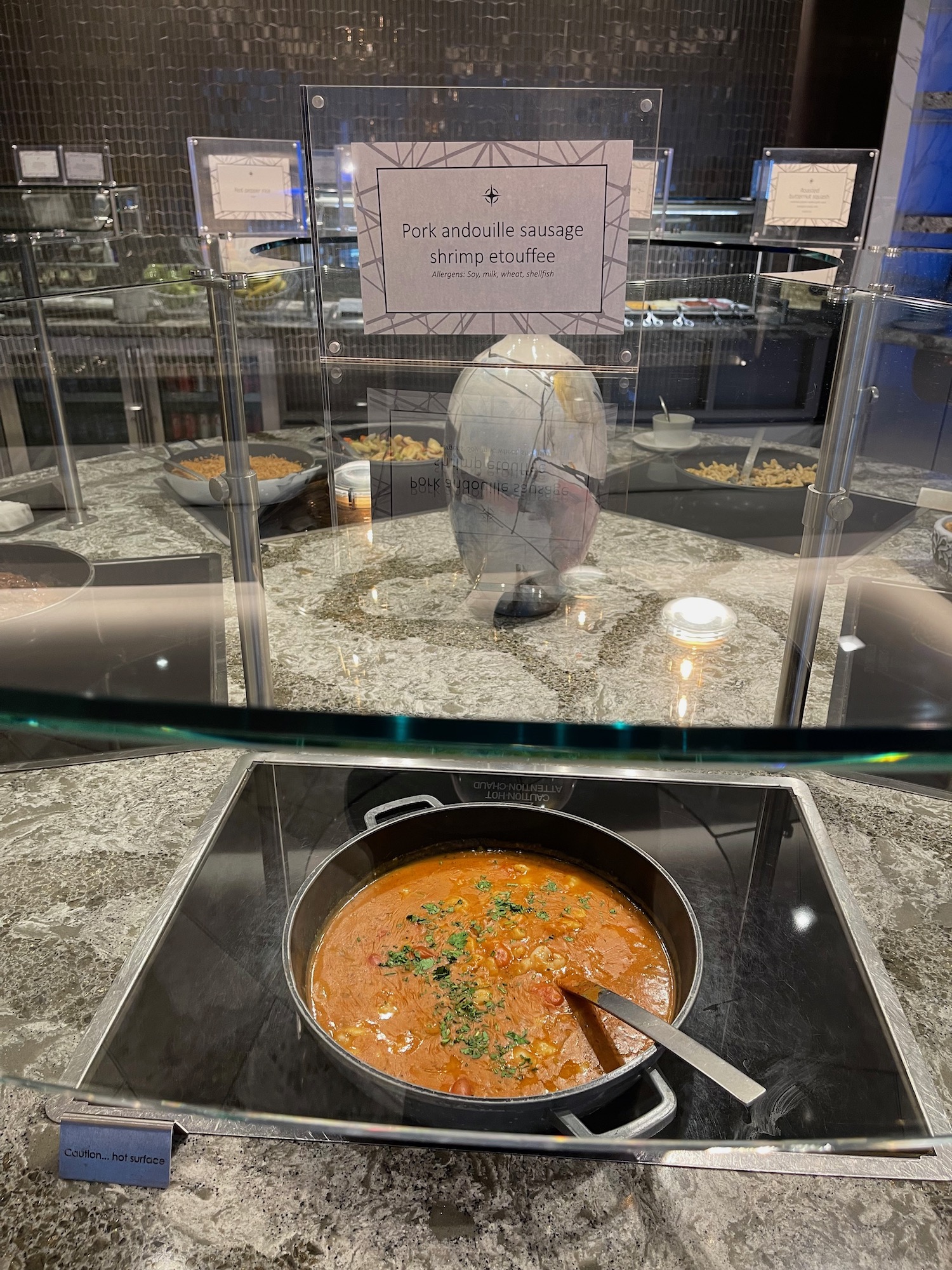 a bowl of soup in a glass case