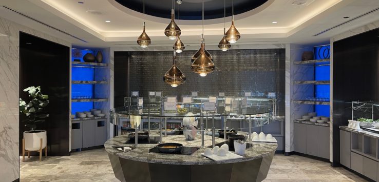 a restaurant with a circular counter and a round counter with a black and white counter