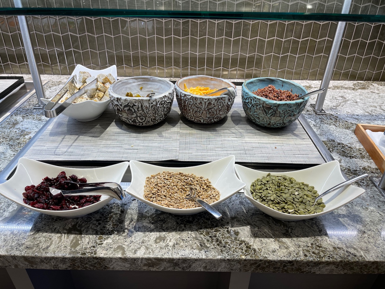 a group of bowls of cereals and seeds