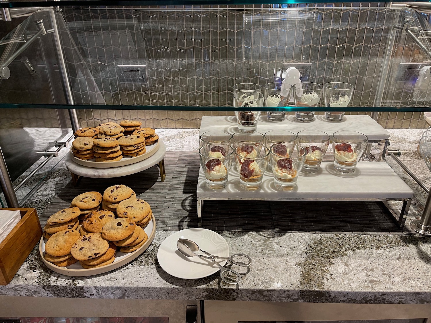 a buffet table with cookies and desserts