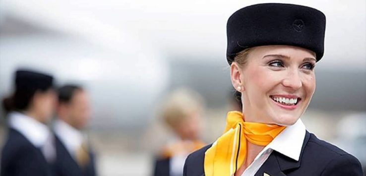 a woman wearing a black hat and yellow scarf