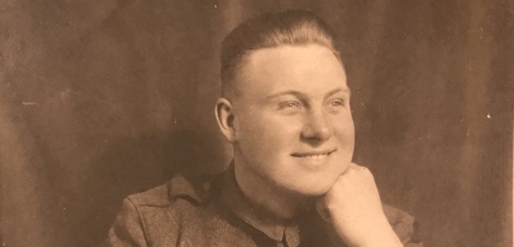 a man in uniform smiling