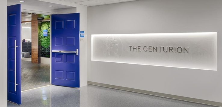 a blue door with a sign on the wall