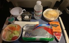 food on a tray on a plane