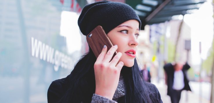 a woman holding a cell phone to her ear