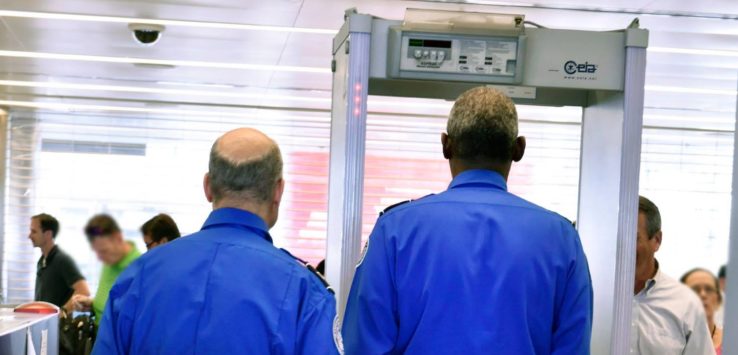 a pair of men in blue uniforms