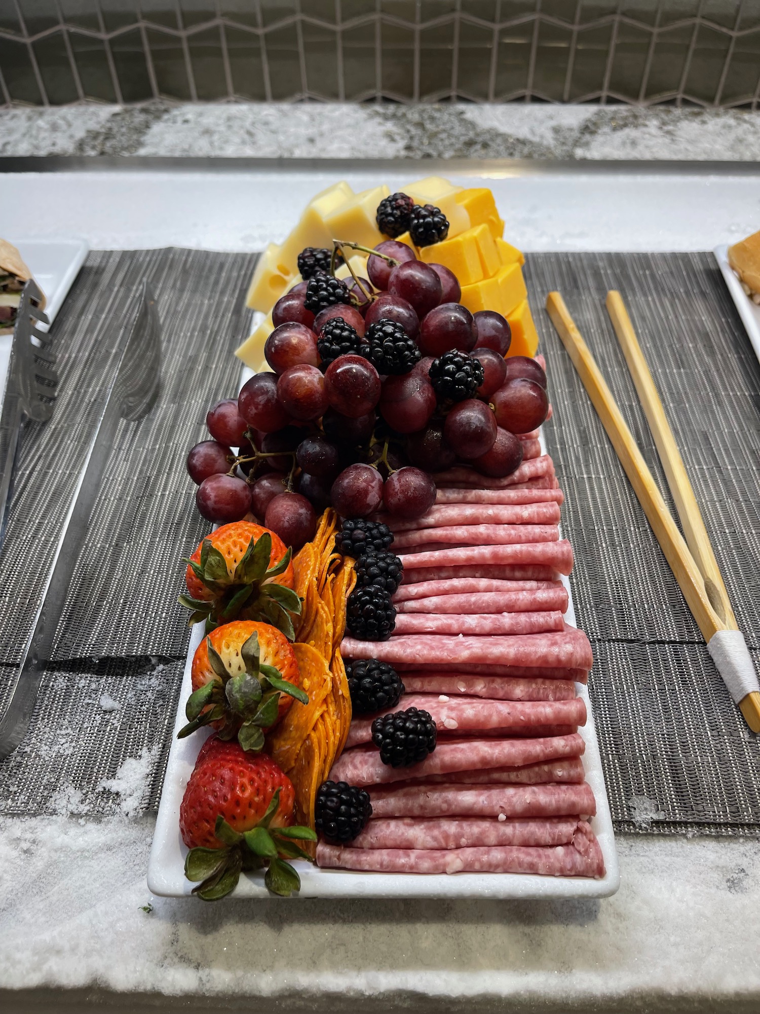 a plate of food with fruit and cheese