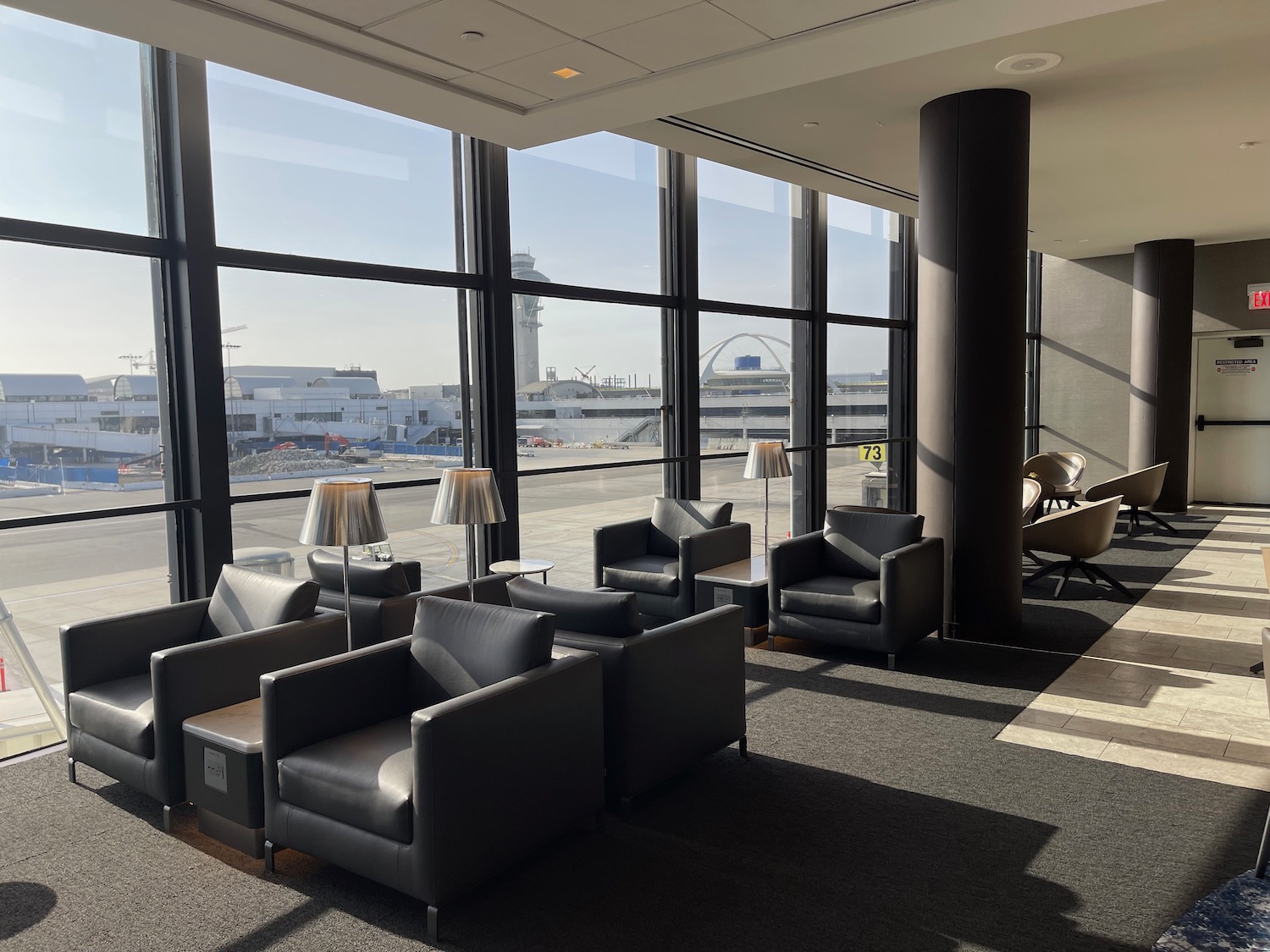 a room with chairs and a large window