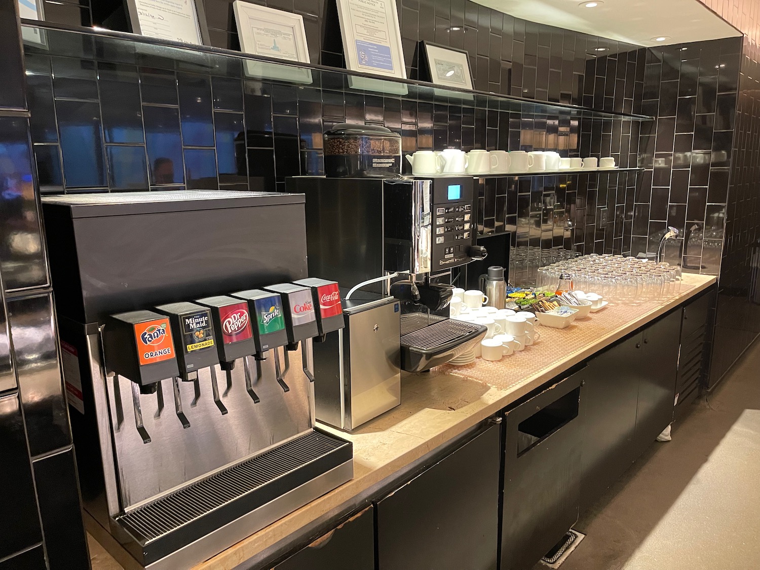 a coffee machine and cups on a counter