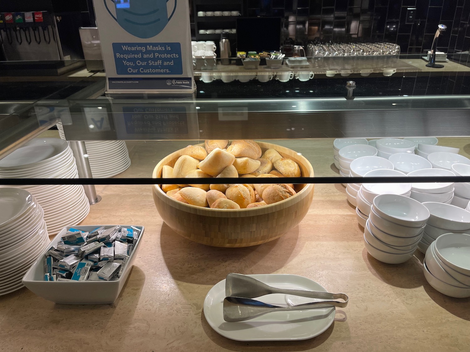 a bowl of bread and other food items on a counter