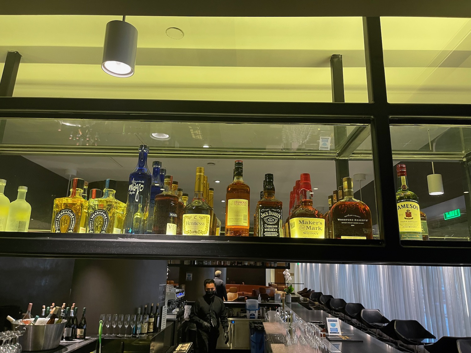 a group of bottles of alcohol on a shelf