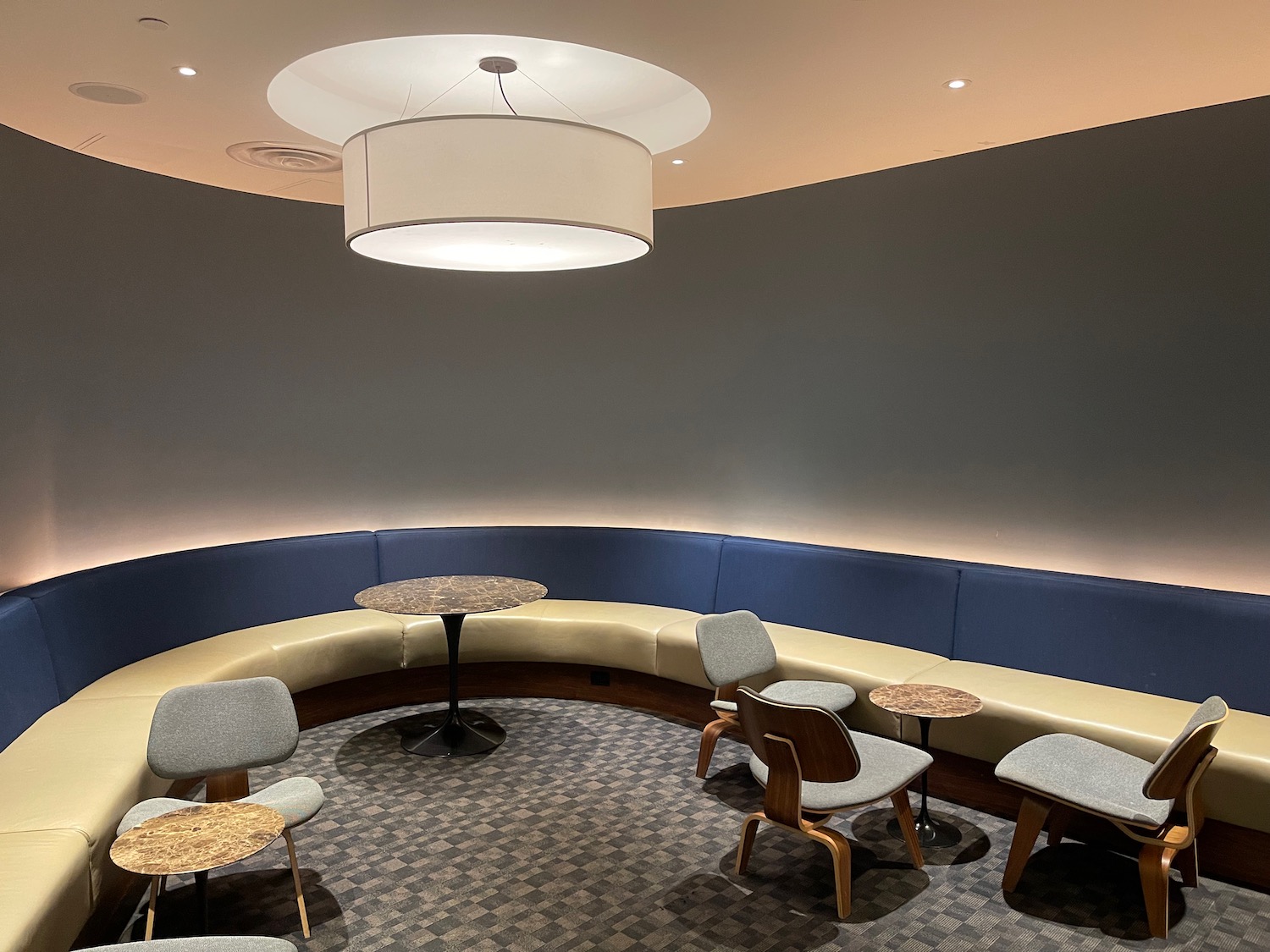 a round table and chairs in a room