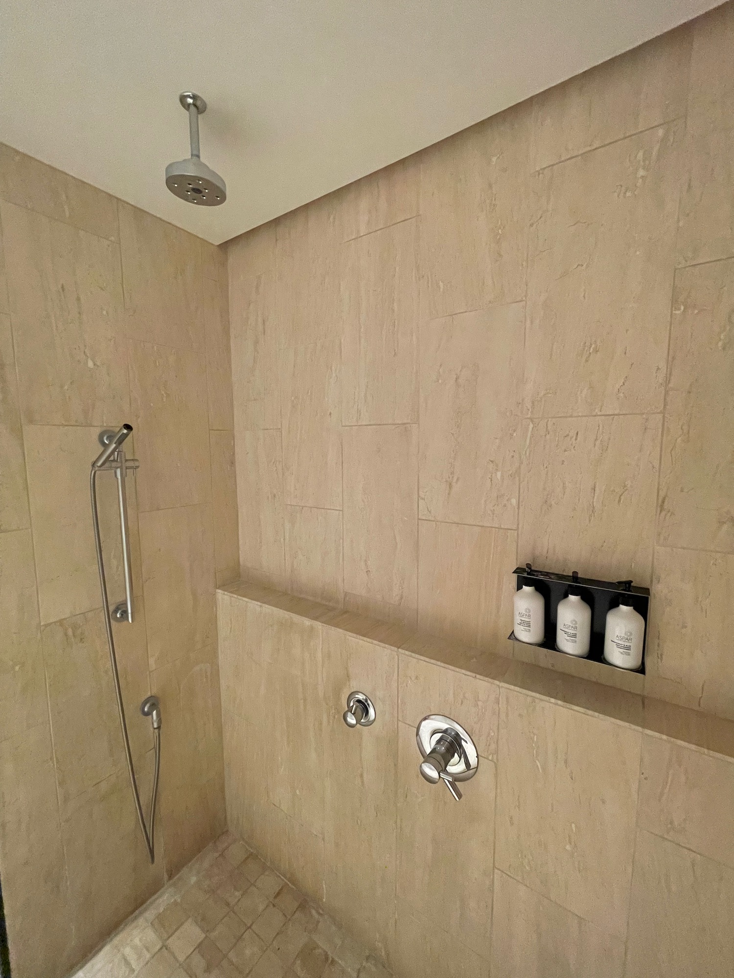 a shower with a shower head and shower head