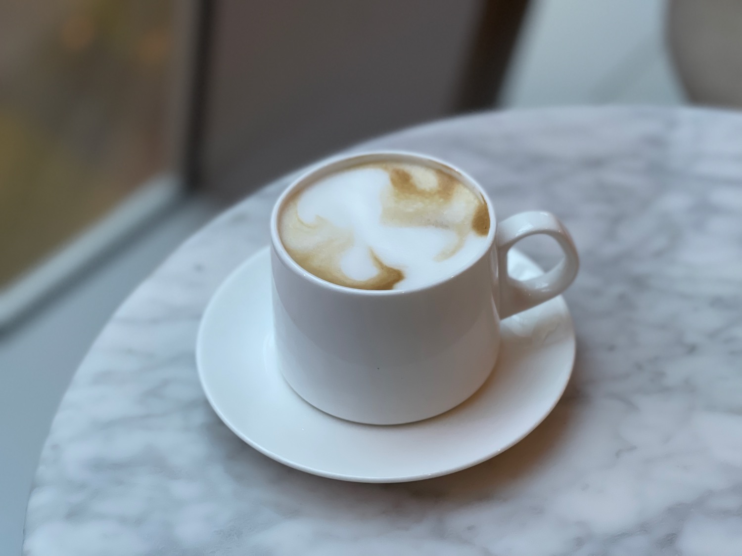 a cup of coffee on a saucer