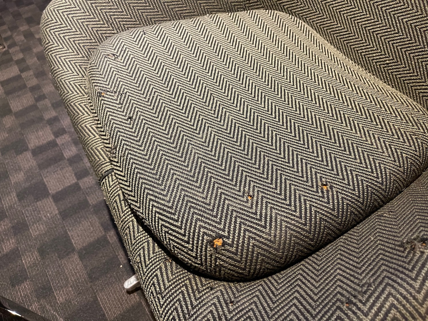 a couch with a rust on the back