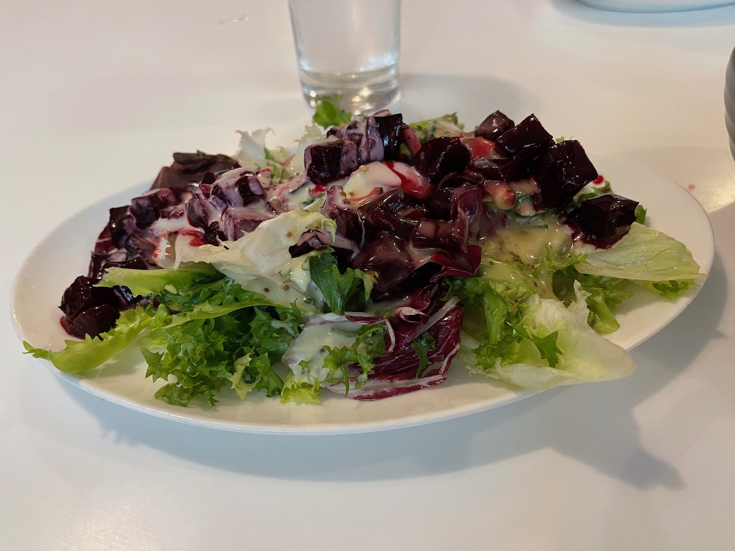 a plate of salad on a table