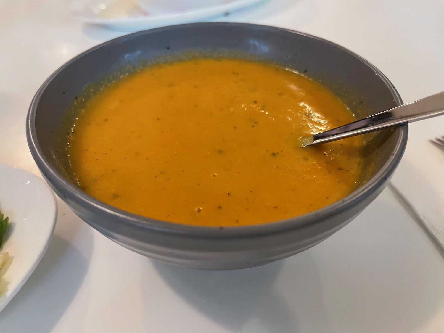 a bowl of soup with a spoon