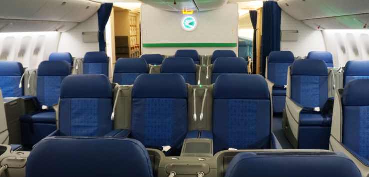 a row of blue seats in an airplane