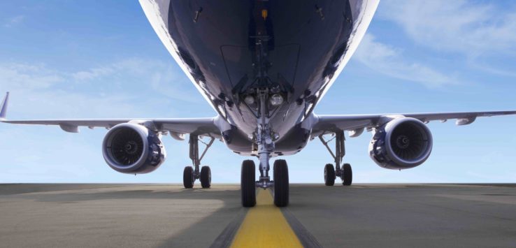 the front of a plane on a runway