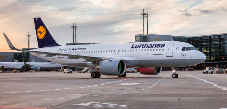 a white airplane on a runway